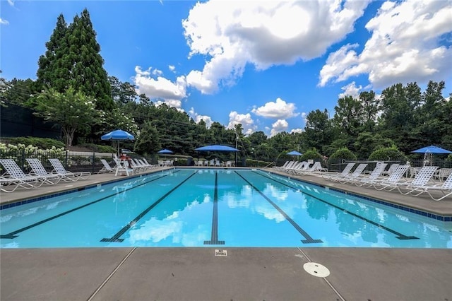 1997 Shaker Falls Ln, Lawrenceville, GA 30045 - community pool featuring a patio area and view of scattered trees