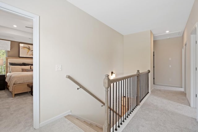 staircase with carpet floors, baseboards, and recessed lighting