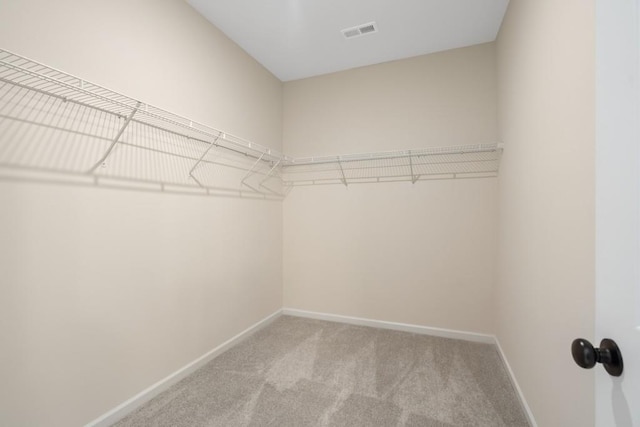 spacious closet with carpet and visible vents