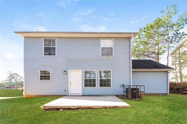 rear view of house featuring central AC unit, a lawn, and a patio