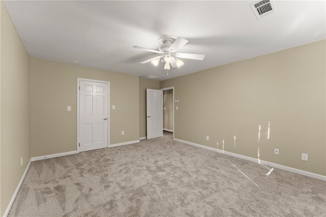 unfurnished bedroom with ceiling fan and light carpet