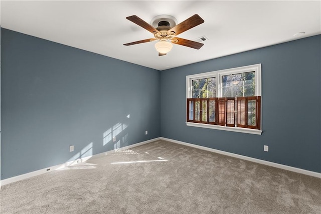 carpeted empty room with ceiling fan