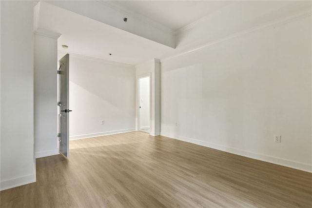 unfurnished room with light hardwood / wood-style floors and ornamental molding