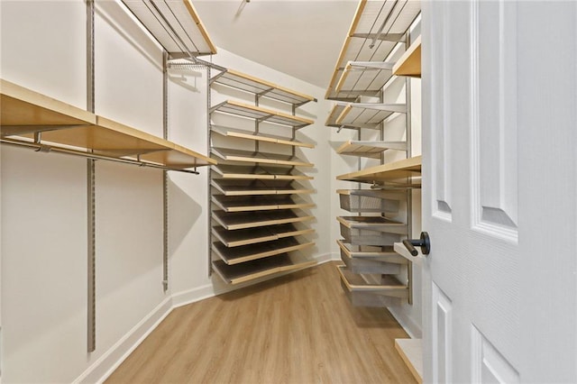 walk in closet featuring light wood-type flooring