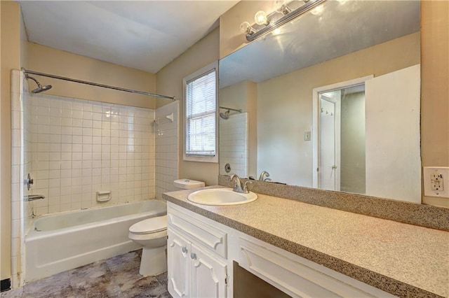 full bathroom with tile patterned floors, vanity, toilet, and tiled shower / bath combo