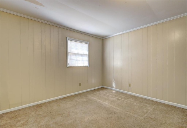 unfurnished room featuring crown molding and light colored carpet