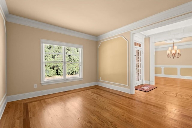 10565 Highgate Manor Ct, Duluth, GA 30097 - spare room with a chandelier, wood finished floors, and crown molding