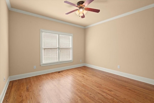 10565 Highgate Manor Ct, Duluth, GA 30097 - spare room featuring ceiling fan, crown molding, and light wood-style floors