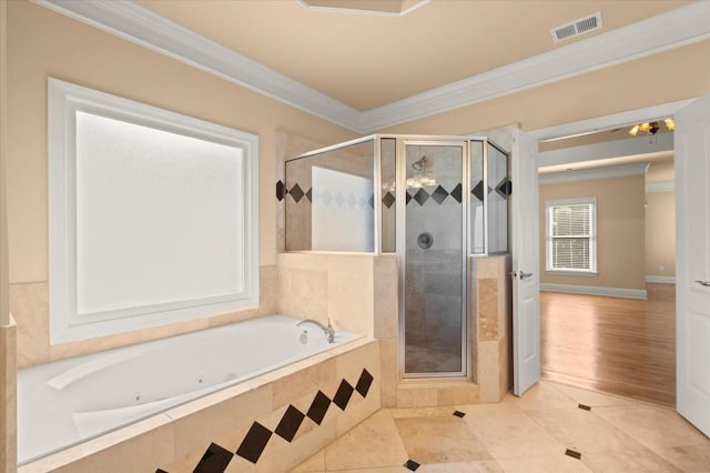10565 Highgate Manor Ct, Duluth, GA 30097 - bathroom with a jetted tub, ornamental molding, a stall shower, and tile patterned flooring