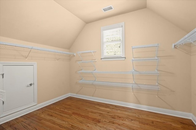 10565 Highgate Manor Ct, Duluth, GA 30097 - spacious closet featuring wood finished floors and lofted ceiling
