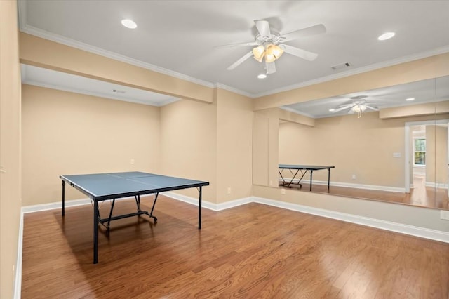 10565 Highgate Manor Ct, Duluth, GA 30097 - rec room with ceiling fan, wood finished floors, crown molding, and recessed lighting