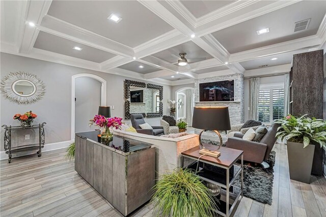 living room featuring beam ceiling, ceiling fan, light hardwood / wood-style floors, and coffered ceiling