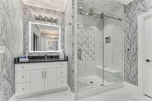 bathroom with crown molding, vanity, and walk in shower