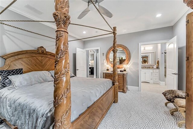 carpeted bedroom featuring ensuite bathroom, crown molding, and ceiling fan