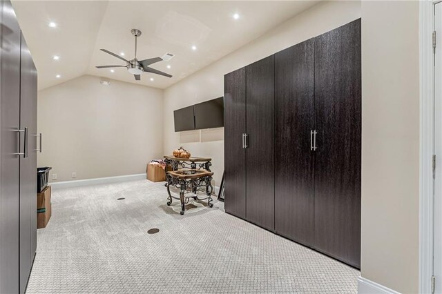 carpeted bedroom with lofted ceiling