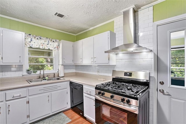 141 Parr Wade Rd SE, Cartersville, GA 30120 - kitchen with gas range, wall chimney exhaust hood, black dishwasher, crown molding, and decorative backsplash
