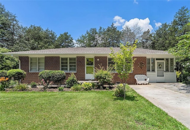 141 Parr Wade Rd SE, Cartersville, GA 30120 - ranch-style home with a front yard, brick siding, and concrete driveway