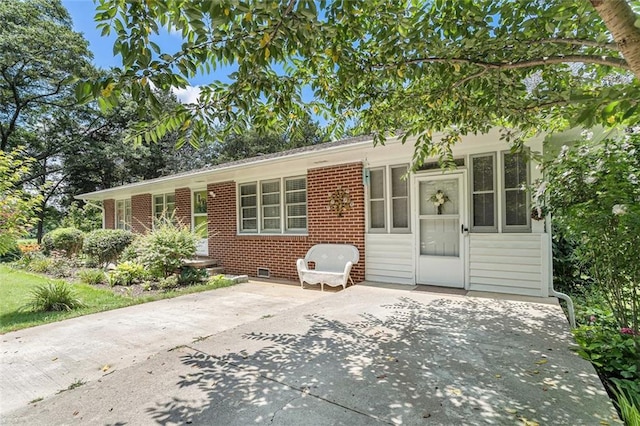 141 Parr Wade Rd SE, Cartersville, GA 30120 - view of front of property featuring brick siding, crawl space, and a patio