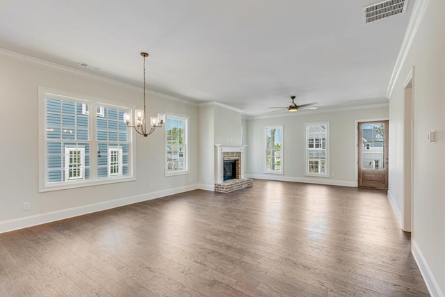 929 Hilltop Park Ct, Dacula, GA 30019 - unfurnished living room with ceiling fan, dark wood-style flooring, baseboards, a chandelier, and crown molding