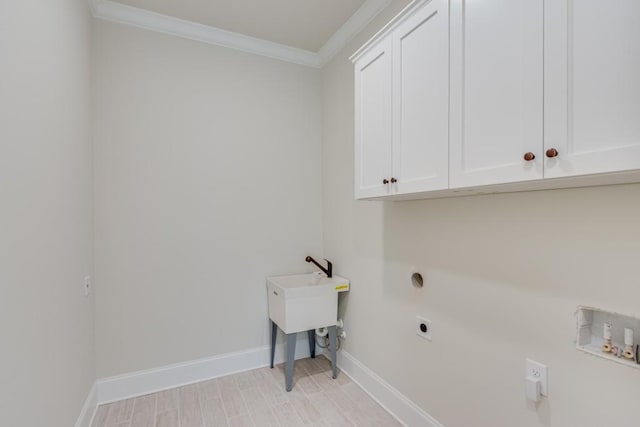 clothes washing area with hookup for an electric dryer, cabinets, crown molding, and hookup for a washing machine