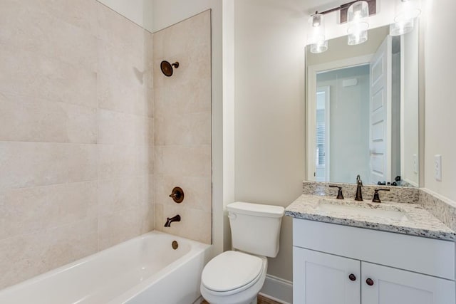 full bathroom featuring vanity, toilet, and tiled shower / bath