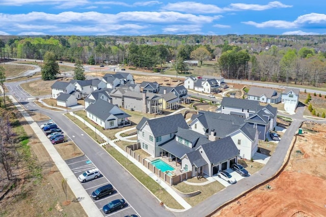 929 Hilltop Park Ct, Dacula, GA 30019 - aerial perspective of suburban area featuring a forest and a pool area