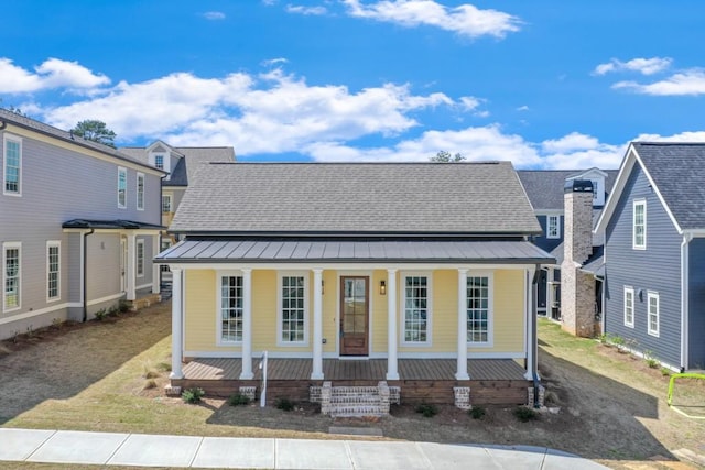 929 Hilltop Park Ct, Dacula, GA 30019 - view of front facade with a porch, a standing seam roof, and metal roof