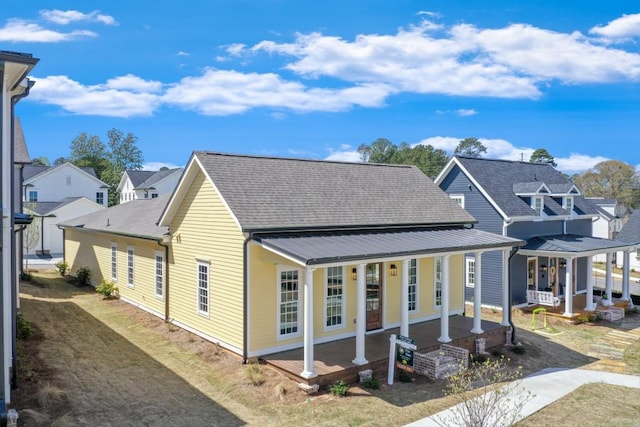 929 Hilltop Park Ct, Dacula, GA 30019 - view of front of home with a porch, a residential view, and roof with shingles