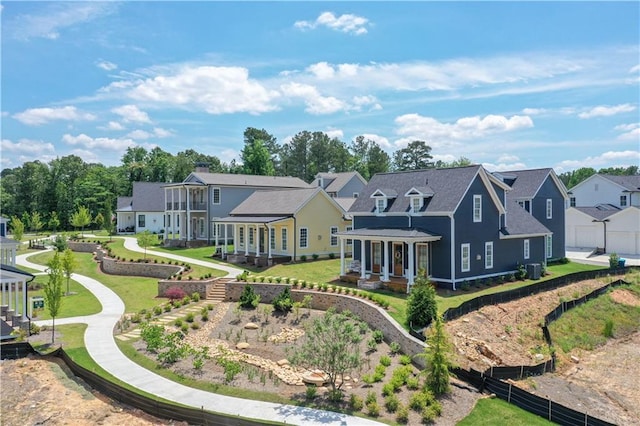929 Hilltop Park Ct, Dacula, GA 30019 - back of house with a residential view, stairway, and covered porch