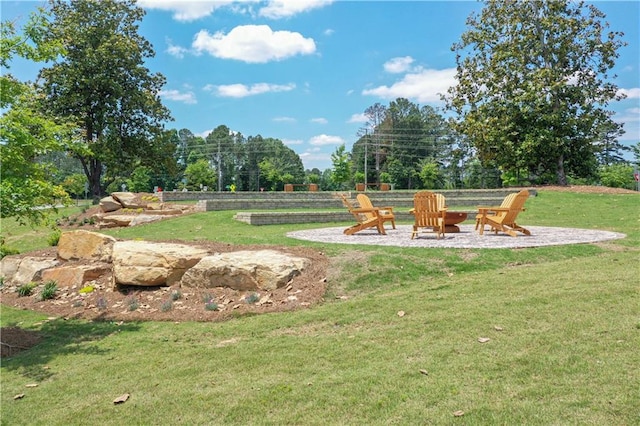 929 Hilltop Park Ct, Dacula, GA 30019 - view of green lawn featuring an outdoor fire pit