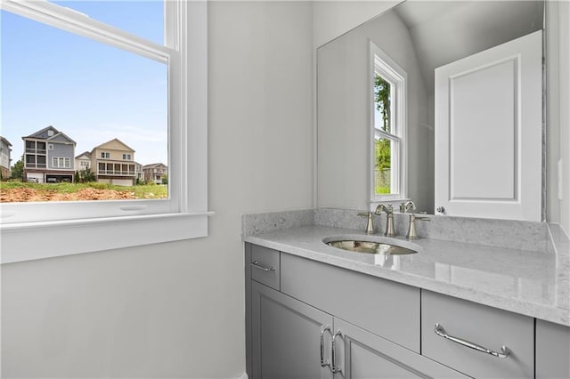 bathroom with vanity and a healthy amount of sunlight