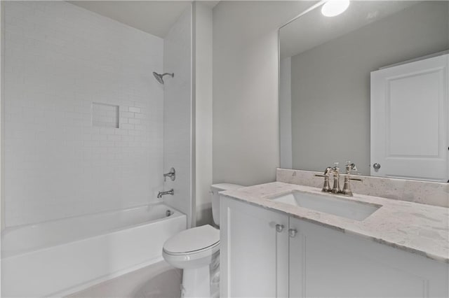 full bath featuring vanity, shower / bathing tub combination, and toilet