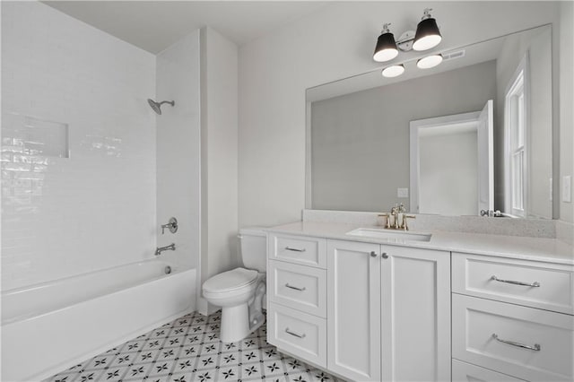 bathroom with vanity, tile patterned floors, toilet, and bathtub / shower combination