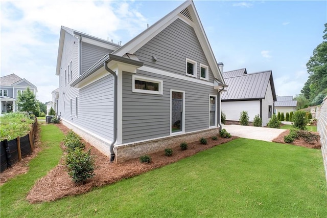 rear view of house with a yard