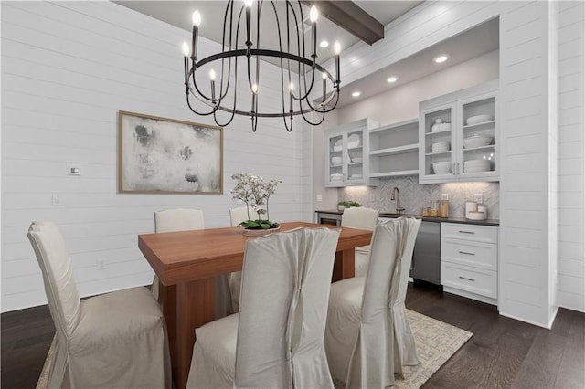 dining room with recessed lighting, beamed ceiling, an inviting chandelier, and dark wood-style flooring