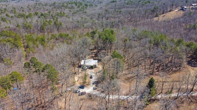 drone / aerial view featuring a view of trees