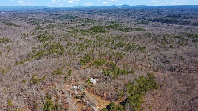 aerial view with a forest view and a mountain view