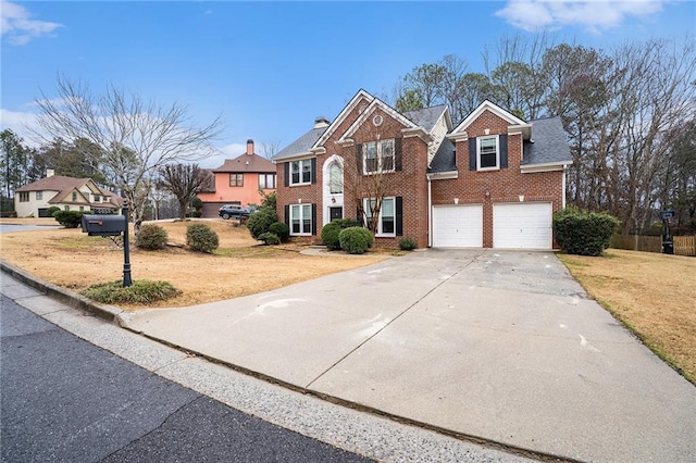 view of front of property featuring a garage, concrete driveway, brick siding, and a front lawn