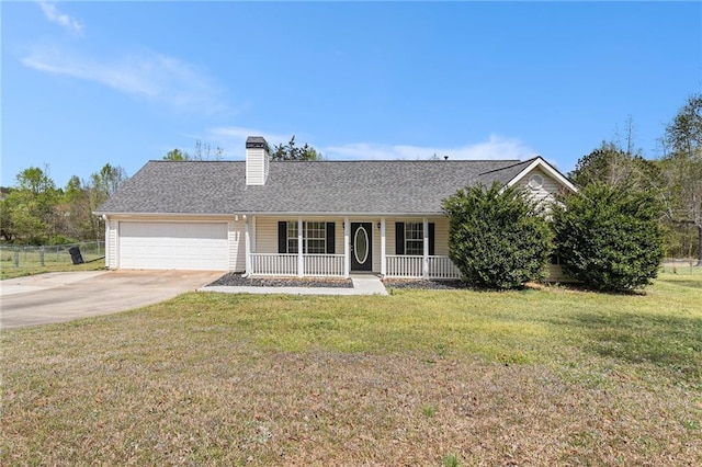 ranch-style home featuring an attached garage, covered porch, driveway, and a front lawn