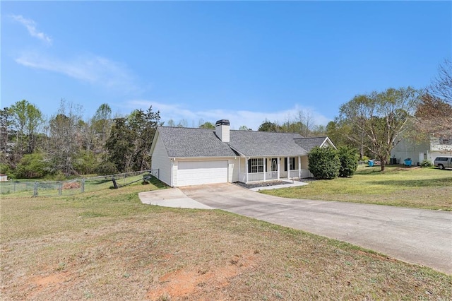 single story home with covered porch, fence, a front lawn, an attached garage, and concrete driveway