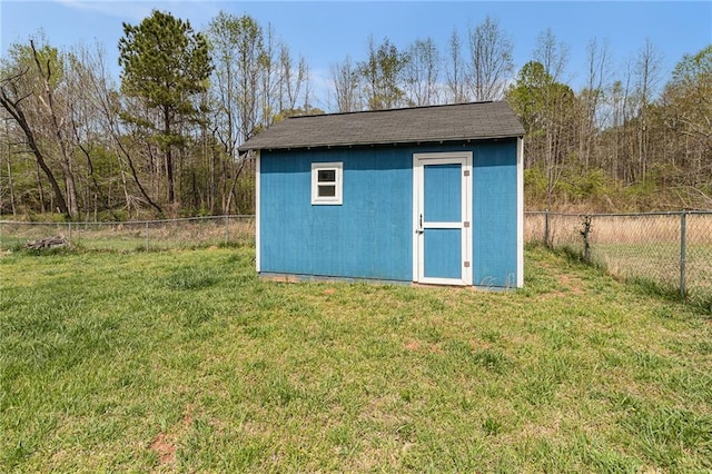 view of shed featuring a fenced backyard