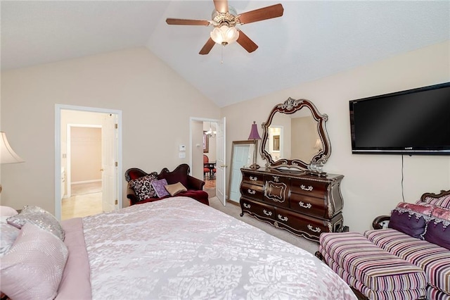 carpeted bedroom featuring lofted ceiling, ensuite bath, and ceiling fan