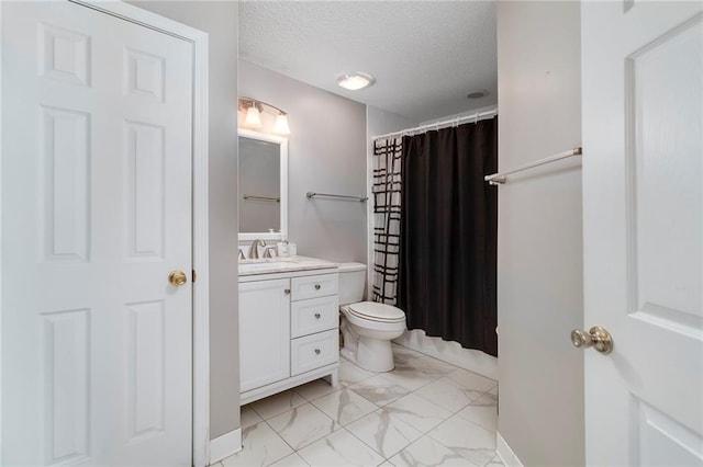 bathroom with vanity, toilet, a textured ceiling, and a shower with curtain