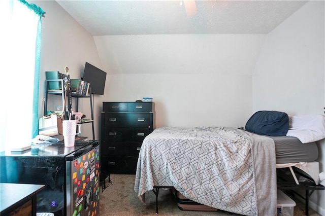 bedroom featuring carpet and lofted ceiling