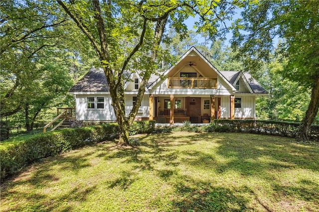 2121 Jep Wheeler Rd, Woodstock, GA 30188 - view of front facade with a balcony, covered porch, a front yard, and board and batten siding