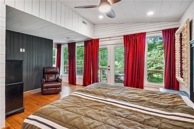 2121 Jep Wheeler Rd, Woodstock, GA 30188 - bedroom featuring access to exterior, wood finished floors, wood walls, multiple windows, and french doors