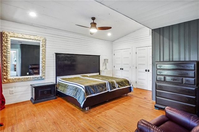 2121 Jep Wheeler Rd, Woodstock, GA 30188 - bedroom with vaulted ceiling, hardwood / wood-style flooring, a ceiling fan, and wood walls