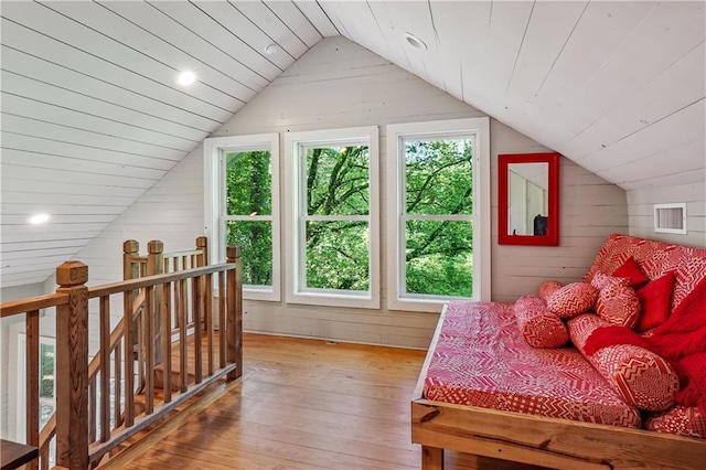 2121 Jep Wheeler Rd, Woodstock, GA 30188 - bedroom featuring wood walls, light wood-style floors, vaulted ceiling, and recessed lighting