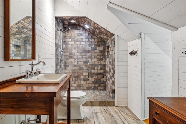 2121 Jep Wheeler Rd, Woodstock, GA 30188 - full bath with vanity, wooden walls, a shower stall, wood finished floors, and lofted ceiling