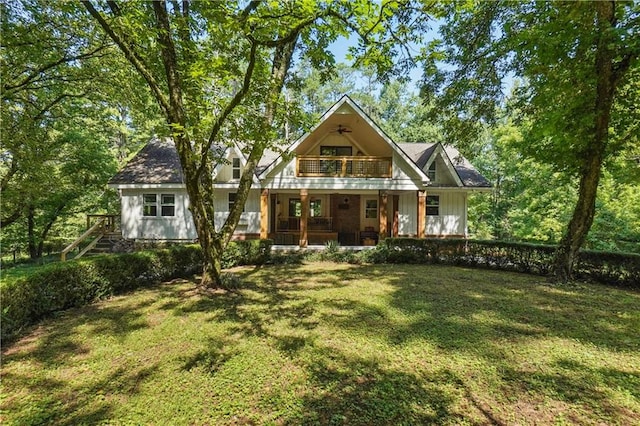2121 Jep Wheeler Rd, Woodstock, GA 30188 - back of property with a balcony, a porch, a yard, and board and batten siding